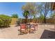 Private backyard featuring desert landscaping and a patio perfect for outdoor dining at 7003 S 23Rd Ln, Phoenix, AZ 85041