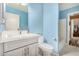 Bright bathroom featuring a modern vanity, sleek fixtures, and a full-sized mirror at 7003 S 23Rd Ln, Phoenix, AZ 85041