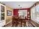 Charming dining area featuring wood floors and views of the backyard at 7003 S 23Rd Ln, Phoenix, AZ 85041