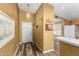 Bright foyer with wood floors, white front door, and coat closet at 7003 S 23Rd Ln, Phoenix, AZ 85041
