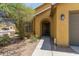 Close-up of a well-maintained home with a charming front entrance and desert landscaping at 7003 S 23Rd Ln, Phoenix, AZ 85041