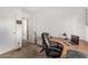 Functional office space featuring large desk, rolling chair, and ample room at 7003 S 23Rd Ln, Phoenix, AZ 85041