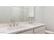 Bathroom featuring double sinks, marble-style countertops, and chrome hardware at 7384 W Buckhorn Trl, Peoria, AZ 85383