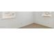 Bright bedroom corner with neutral carpet and large windows letting in natural light at 7384 W Buckhorn Trl, Peoria, AZ 85383