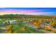 Aerial view showcasing the community, golf course, ponds, and mountain backdrop at 7424 N Via Camello Del Norte -- # 185, Scottsdale, AZ 85258