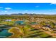 Beautiful aerial view of property on golf course with mountain backdrop and blue skies at 7424 N Via Camello Del Norte -- # 185, Scottsdale, AZ 85258