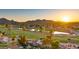 Serene aerial view of home nestled in a lush golf course community with mountain views at 7424 N Via Camello Del Norte -- # 185, Scottsdale, AZ 85258