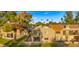 Exterior of home features a well-kept lawn, patio, balcony and mature trees at 7424 N Via Camello Del Norte -- # 185, Scottsdale, AZ 85258