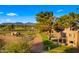 Charming exterior view of a home with balcony overlooking the lush green golf course at 7424 N Via Camello Del Norte -- # 185, Scottsdale, AZ 85258