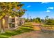 Exterior of a home with mature landscaping, walkway and golf course views at 7424 N Via Camello Del Norte -- # 185, Scottsdale, AZ 85258