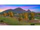 Scenic golf course view with mature trees and the McDowell Mountains in the background at sunset at 7424 N Via Camello Del Norte -- # 185, Scottsdale, AZ 85258