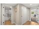 Bright hallway featuring stylish doors leading to a bathroom and bedroom, offering seamless home transitions at 7424 N Via Camello Del Norte -- # 185, Scottsdale, AZ 85258