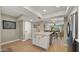 Bright kitchen with an island, stainless steel appliances, and open access to the dining and living areas at 7424 N Via Camello Del Norte -- # 185, Scottsdale, AZ 85258
