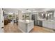 Modern kitchen featuring stainless steel appliances, a large island, and a view to the living area and patio at 7424 N Via Camello Del Norte -- # 185, Scottsdale, AZ 85258