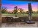 Charming patio seating area perfect for enjoying views of the golf course and vibrant desert sunsets at 7424 N Via Camello Del Norte -- # 185, Scottsdale, AZ 85258