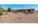 Spacious backyard with desert landscaping, patio area, and a hammock for relaxation at 772 Leisure World --, Mesa, AZ 85206