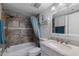 Well-lit bathroom includes a shower over tub with tile surround, and a vanity at 772 Leisure World --, Mesa, AZ 85206