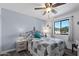Comfortable bedroom featuring a ceiling fan and natural light from the window at 772 Leisure World --, Mesa, AZ 85206
