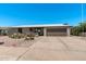 Inviting single-story home with a well-manicured desert front yard, driveway, and attached garage at 772 Leisure World --, Mesa, AZ 85206