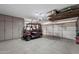 Large garage with ample storage cabinets and a convenient golf cart at 772 Leisure World --, Mesa, AZ 85206