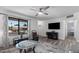 Well-lit living room with modern decor, featuring a large window and stylish furniture at 772 Leisure World --, Mesa, AZ 85206