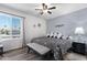 Relaxing main bedroom featuring a ceiling fan, gray accents, and ample natural light at 772 Leisure World --, Mesa, AZ 85206