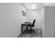 Well-lit office with a gray desk, chair, and wood-look floors, featuring storage cabinets and a window at 772 Leisure World --, Mesa, AZ 85206