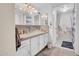 Well-lit bathroom with a glass vessel sink, white cabinetry, and neutral countertops at 8202 N 21St Dr # B101, Phoenix, AZ 85021