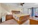 Bright bedroom featuring a large bed, sliding doors to the exterior, and lots of natural light at 8202 N 21St Dr # B101, Phoenix, AZ 85021