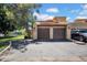 Exterior shot of a two-car garage with a well-maintained driveway at 8202 N 21St Dr # B101, Phoenix, AZ 85021