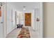 Inviting home hallway features tiled floors, storage closets, and a wooden front door with decorative details at 8202 N 21St Dr # B101, Phoenix, AZ 85021