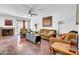 Cozy living room features fireplace, comfortable seating, and a ceiling fan for relaxed living and entertaining at 8202 N 21St Dr # B101, Phoenix, AZ 85021