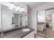 Bathroom with white vanity, stone countertop, and large mirror reflects more of the space at 8414 N Central Ave # C, Phoenix, AZ 85020