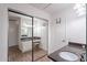 Bathroom featuring a vanity with a dark countertop and a large mirrored closet at 8414 N Central Ave # C, Phoenix, AZ 85020