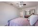 Bright bedroom with a ceiling fan and mirror closet, showcasing modern design at 8414 N Central Ave # C, Phoenix, AZ 85020