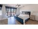 Bedroom featuring a bed with sliding door to the balcony with beautiful neighborhood views at 8414 N Central Ave # C, Phoenix, AZ 85020