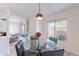 Bright dining area featuring a glass table, seating, and a large window with a pleasant outdoor view at 8414 N Central Ave # C, Phoenix, AZ 85020