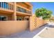 Inviting two-story condo featuring neutral stucco, upper balcony, and decorative privacy walls at 8414 N Central Ave # C, Phoenix, AZ 85020