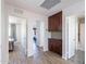 Hallway with wood floors, storage cabinets, and entryways to other rooms at 8414 N Central Ave # C, Phoenix, AZ 85020