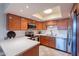 A bright kitchen with wooden cabinets, stainless steel appliances and lots of counter space at 8414 N Central Ave # C, Phoenix, AZ 85020