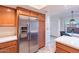 Modern kitchen featuring stainless steel refrigerator, wood cabinets, and sleek countertops at 8414 N Central Ave # C, Phoenix, AZ 85020