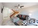 Bright living room with tile flooring, staircase, ceiling fan and comfortable sofa at 8414 N Central Ave # C, Phoenix, AZ 85020