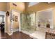 Well-lit bathroom with walk-in shower, wood floors, and neutral colors throughout at 8540 W Wescott Dr, Peoria, AZ 85382
