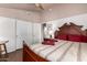 Bedroom features wood floors, neutral paint, and a double door closet at 8540 W Wescott Dr, Peoria, AZ 85382