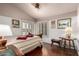 Bright bedroom with wood floors, window shutters, and neutral paint at 8540 W Wescott Dr, Peoria, AZ 85382