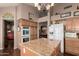 Bright eat-in kitchen area with an island and sleek, stainless-steel appliances at 8540 W Wescott Dr, Peoria, AZ 85382