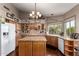 Spacious kitchen features an island, granite countertops, and ample cabinet space at 8540 W Wescott Dr, Peoria, AZ 85382