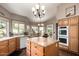 Well-appointed kitchen with granite countertops, a central island, and built-in appliances at 8540 W Wescott Dr, Peoria, AZ 85382