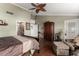 Cozy main bedroom features dark wood floors, high ceilings, and access to another room at 8540 W Wescott Dr, Peoria, AZ 85382
