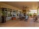 Covered patio with outdoor seating and fireplace, offering a cozy backyard space at 8540 W Wescott Dr, Peoria, AZ 85382